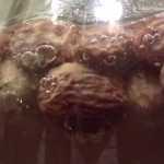 Close up of raisins in cider